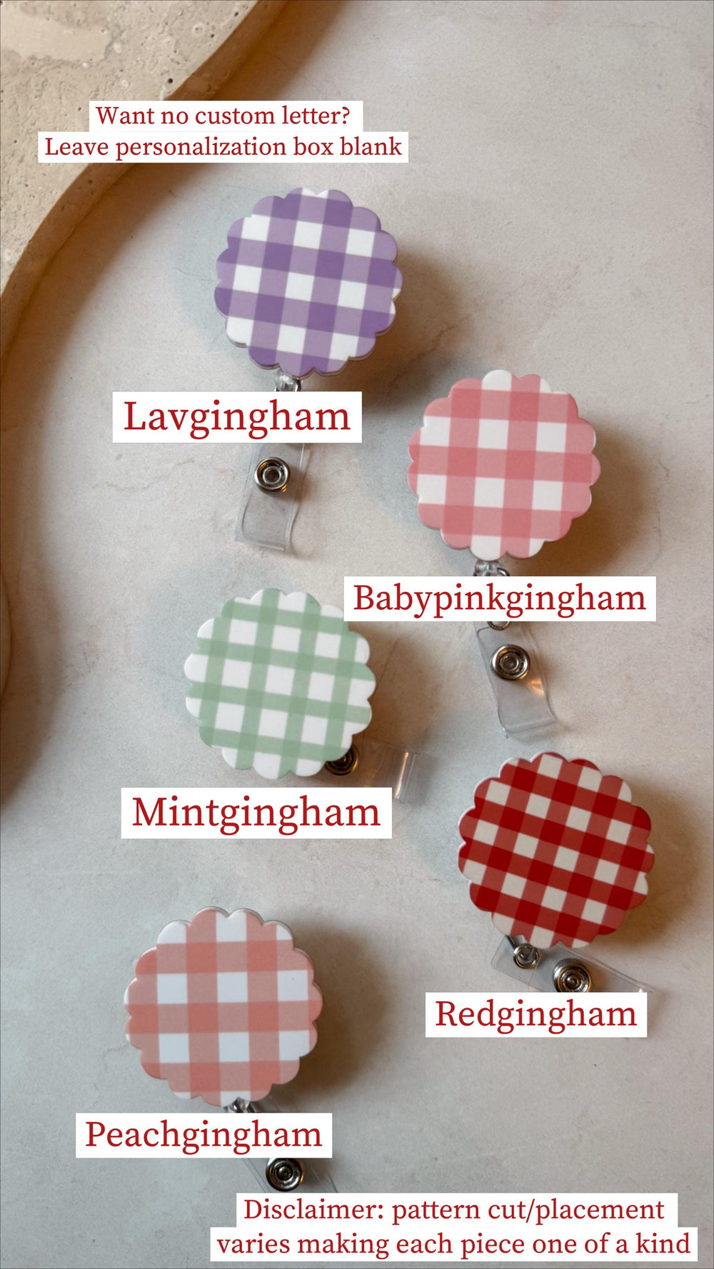 A collection of six badge reels with scalloped edges and gingham patterns in various colors: lavender, pink, mint green, red, and peach. Each reel has a clear plastic strap and a metal clip. Text on t