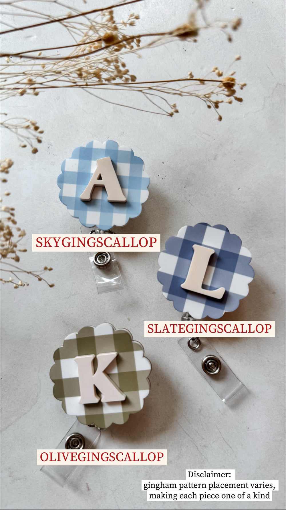 Three badge reels with scalloped edges and gingham patterns in blue, olive green, and navy. Each reel features a different letter: A, L, and K, in a neutral color. The text "SKYGINGSCALLOP", "SLATEGIN
