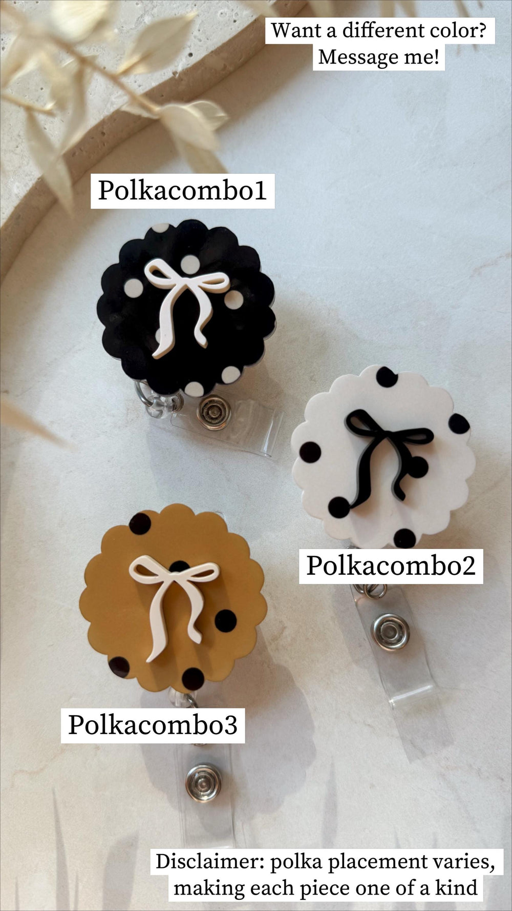 Three badge reels with scalloped edges and polka dots. One is black with white dots and a white bow, another is white with black dots and a black bow, and the third is tan with black dots and a white 