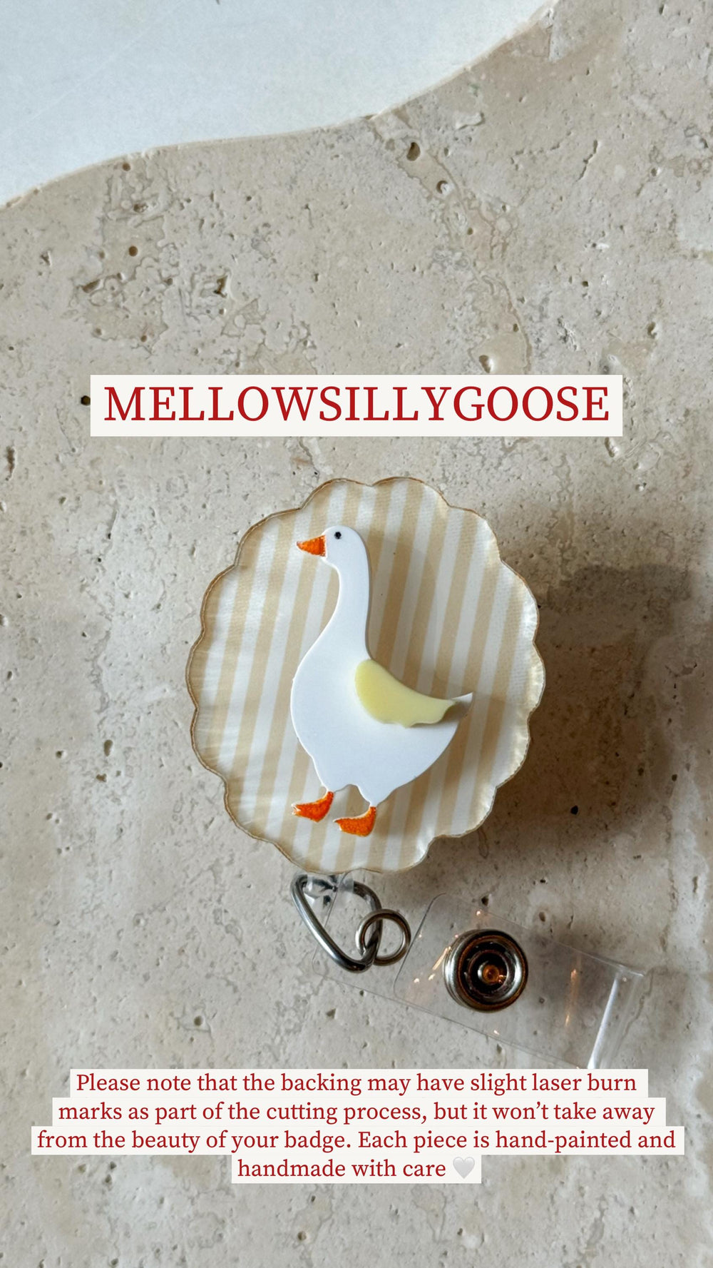 A badge with a white goose design, featuring orange feet and beak, and yellow wings. The goose is set against a striped background. The badge reads "MELLOWSILLYGOOSE". Each piece is hand-painted and h