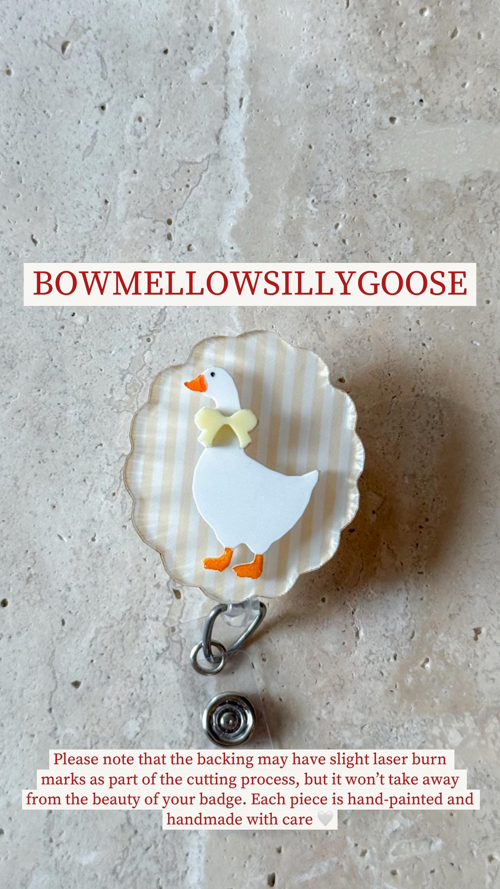 A badge reel featuring a white goose with orange feet and beak, and a yellow bow tie. The goose is set against a striped background. The text "BOWMELLOWSILLYGOOSE" is at the top.