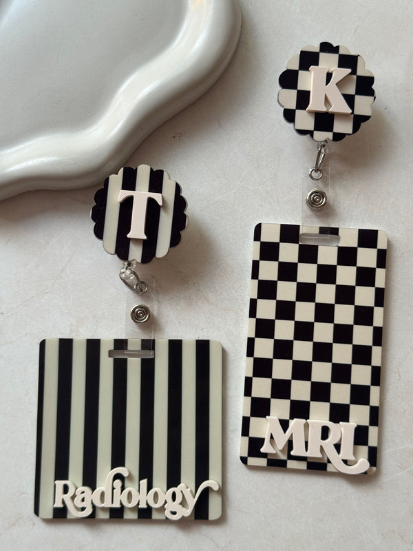 Checkered black badge buddy and reel set, stripes black badge reel and id holder